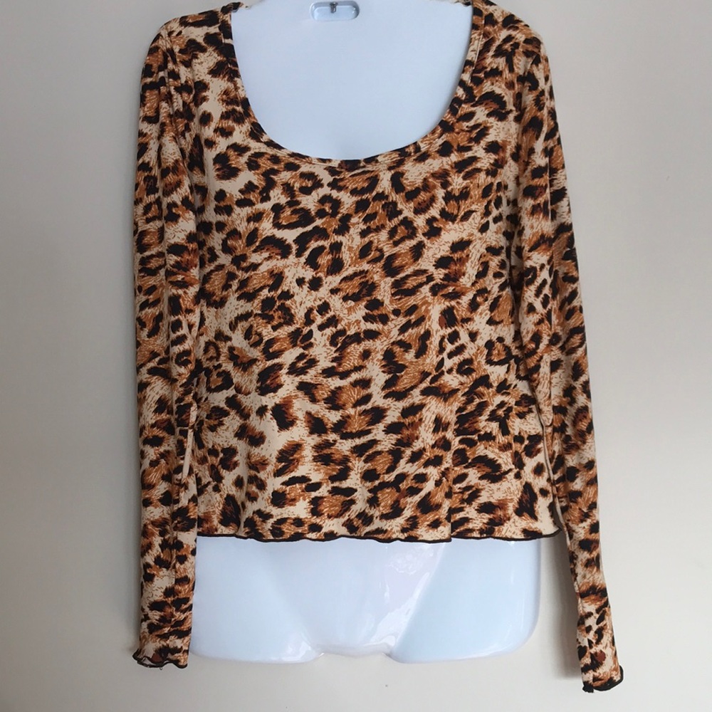 Olivia Rae animal print long sleeves blouse.